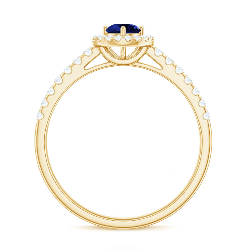 Lab-grown blue sapphire diamond engagement ring with halo setting, 0.6 carats, from Rosec Jewels, showcasing intricate design and sparkling stones.