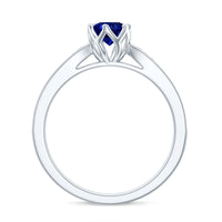 Certified lab-created blue sapphire engagement ring with diamond side stones, featuring a minimalist design by Rosec Jewels.