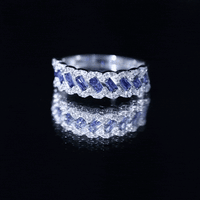 Rosec Jewels blue sapphire and diamond half eternity band ring featuring lab-grown baguette sapphires and sparkling diamonds.