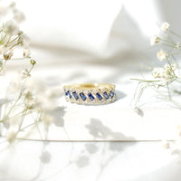 Rosec Jewels blue sapphire and diamond half eternity band ring with lab-grown baguette sapphires and sparkling accents.