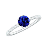 Rosec Jewels 5mm lab-created blue sapphire promise ring with diamond side stones showcasing a sleek gold band and sparkling accents.