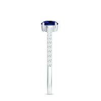 Lab-created blue sapphire promise ring with diamond side stones, featuring a 5mm round blue sapphire, by Rosec Jewels.