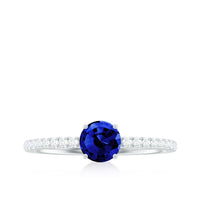 Rosec Jewels 5mm lab-created blue sapphire promise ring with diamond side stones, featuring a sleek and elegant design.