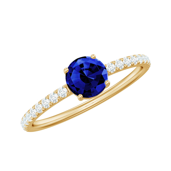 Lab-created blue sapphire promise ring with diamond side stones, featuring a 5mm blue sapphire centerpiece from Rosec Jewels.