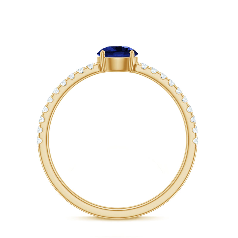 Rosec Jewels 5mm lab-created blue sapphire promise ring with diamond side stones, showcasing the elegant ring design.