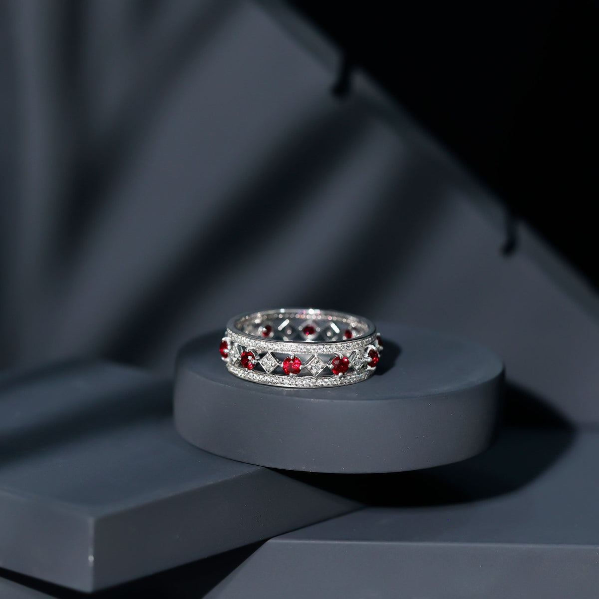 Vintage wedding band ring by Rosec Jewels featuring lab-grown ruby and moissanite accents, elegant and sparkling jewelry piece.