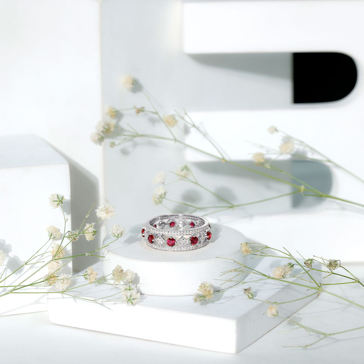 Vintage lab-grown ruby wedding band ring with moissanite gemstones, crafted by Rosec Jewels, showcasing intricate design and sparkling stones.