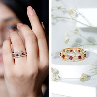 Lab grown ruby vintage wedding band ring with moissanite gemstones, featuring intricate floral design and rose gold finish.