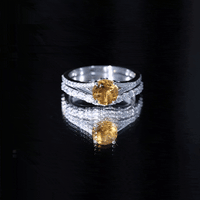 Certified real citrine engagement ring with a moissanite wedding band, featuring gold setting and intricate detailing.