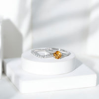 Certified real citrine engagement ring with moissanite wedding band, showcasing a gold ring with a large central citrine gemstone.