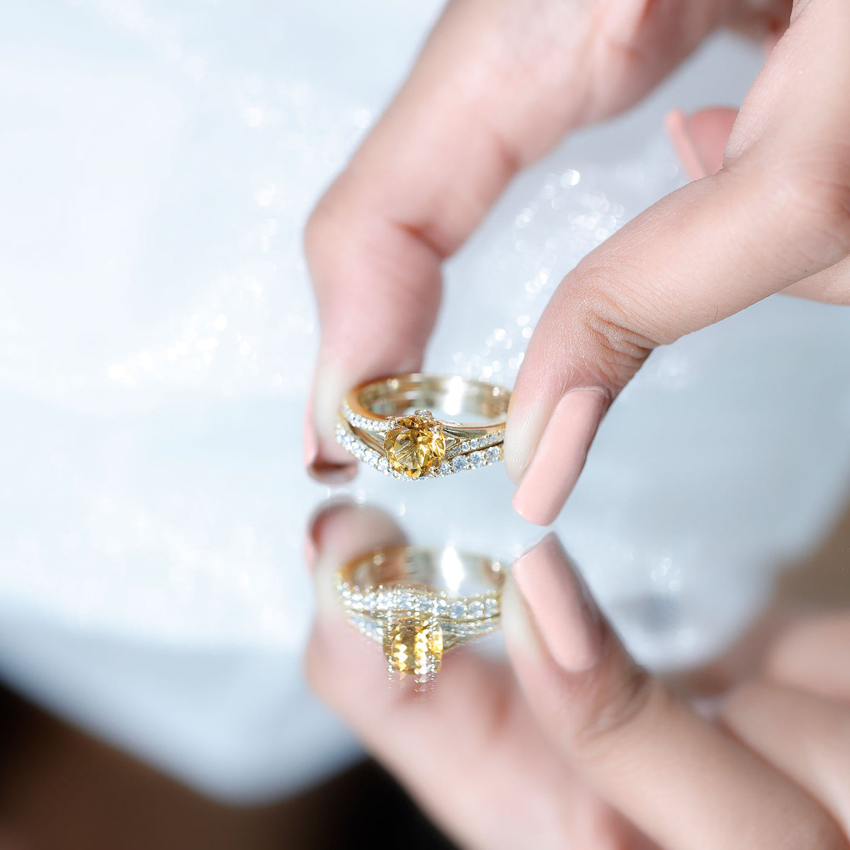 Certified real citrine engagement ring with a moissanite wedding band, featuring gold band and sparkling gemstones.