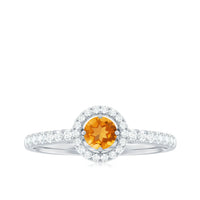Minimalist Citrine and Diamond engagement ring with halo setting by Rosec Jewels, showcasing a sleek band and sparkling stones.