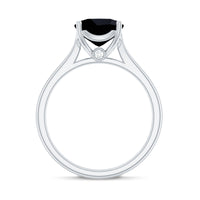 Cushion cut black onyx solitaire engagement ring by Rosec Jewels featuring a 2 carat black onyx stone and silver band.