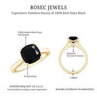 Cushion cut black onyx solitaire engagement ring from Rosec Jewels featuring a 2 carat black onyx gemstone on a silver band.