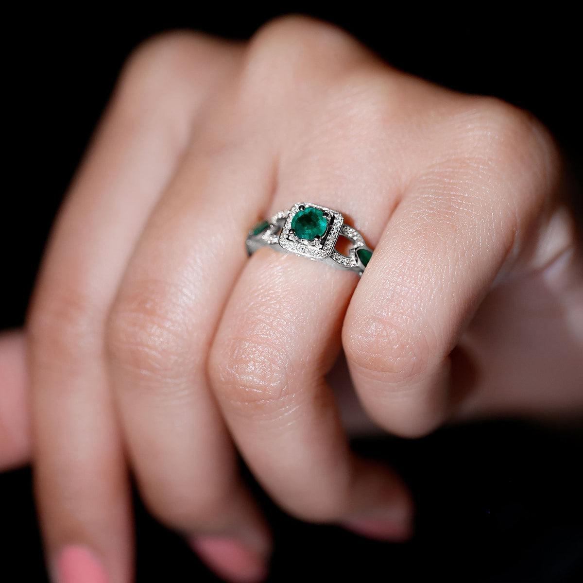 Vintage style Emerald and Diamond engagement ring for women featuring a central emerald with diamond accents, crafted by Rosec Jewels.