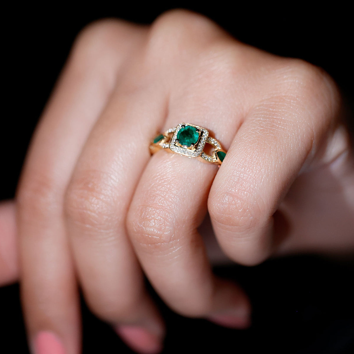 Vintage style emerald and diamond engagement ring for women featuring intricate gold band by Rosec Jewels.