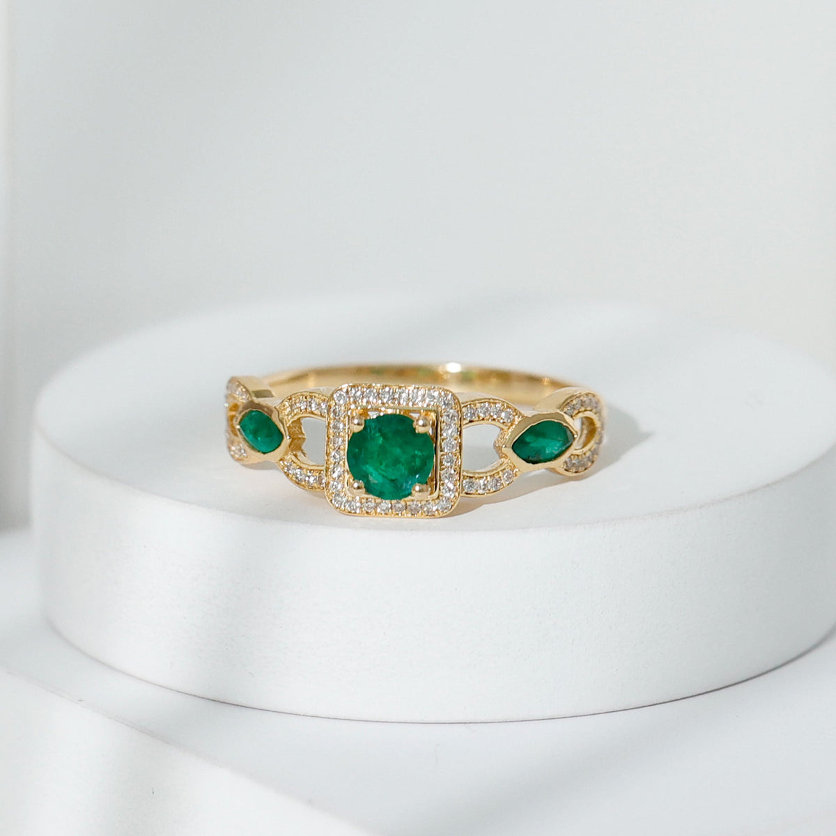 Vintage style emerald and diamond engagement ring for women, featuring intricate design and sparkling gemstones by Rosec Jewels.