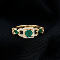 Vintage style emerald and diamond engagement ring for women featuring a Rosec Jewels design with intricate detailing and sparkling gemstones.