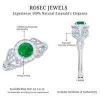 Vintage-inspired engagement ring featuring an emerald and diamond accents from Rosec Jewels, showcasing intricate design and sparkling gemstones.