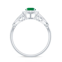 Vintage-inspired engagement ring featuring a AAA quality emerald center stone with diamond accents, crafted by Rosec Jewels.