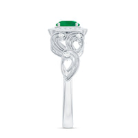 Vintage emerald engagement ring with diamond halo, Rosec Jewels, showcasing intricate design and sparkling gemstones.