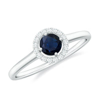 Dainty blue sapphire and diamond floating halo ring by Rosec Jewels, featuring a delicate design with sparkling gemstones.
