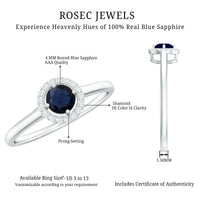 Dainty blue sapphire and diamond floating halo ring by Rosec Jewels, featuring a central sapphire surrounded by sparkling diamonds.