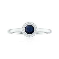 Dainty blue sapphire and diamond floating halo ring by Rosec Jewels, featuring a central sapphire surrounded by sparkling diamonds.