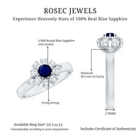 Blue sapphire flower engagement ring with diamond accents by Rosec Jewels, featuring a detailed floral design and sparkling gemstones.