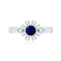 Blue sapphire flower engagement ring with diamond accents, crafted by Rosec Jewels, featuring a detailed floral design and sparkling gemstones.