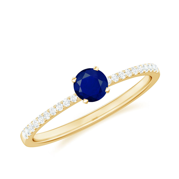 Real 0.9 carat blue sapphire promise ring with diamonds by Rosec Jewels, featuring a central blue sapphire gemstone and diamond accents.