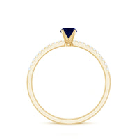 Real 0.9 carat blue sapphire promise ring with diamonds from Rosec Jewels, featuring a gold band and sparkling gemstone accents.