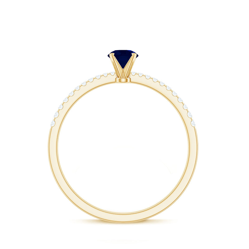 Real 0.9 carat blue sapphire promise ring with diamonds from Rosec Jewels, featuring a gold band and sparkling gemstone accents.