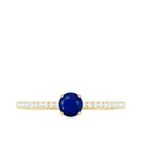 Real 0.9 carat blue sapphire promise ring with diamonds, featuring a silver band and elegant gemstone setting.