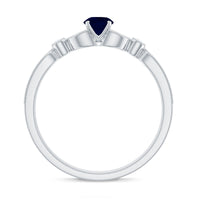 Vintage-inspired blue sapphire and diamond engagement ring with milgrain details by Rosec Jewels, showcasing intricate craftsmanship.