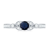 Vintage-inspired blue sapphire and diamond engagement ring with milgrain details from Rosec Jewels, showcasing intricate design and sparkling stones.