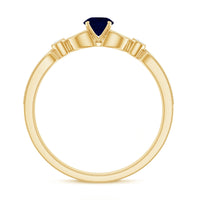 Vintage inspired blue sapphire and diamond engagement ring with milgrain details from Rosec Jewels, showcasing intricate design and sparkling gems.
