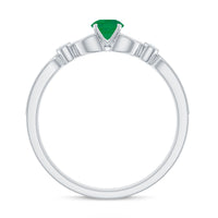 Vintage-inspired engagement ring featuring a natural emerald and diamond accents, crafted by Rosec Jewels.