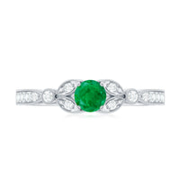 Vintage-inspired engagement ring featuring a natural emerald and diamond accents by Rosec Jewels, showcasing intricate design and craftsmanship.