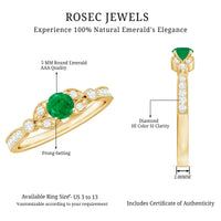 Vintage-inspired engagement ring featuring a natural emerald and diamond accents by Rosec Jewels, with intricate metal detailing.
