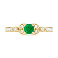 Natural emerald vintage-inspired engagement ring with diamond accents from Rosec Jewels, showcasing intricate design and vibrant green gemstone.