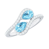 Genuine aquamarine two-stone engagement ring with diamonds, featuring a Rosec Jewels' ring in gold setting.