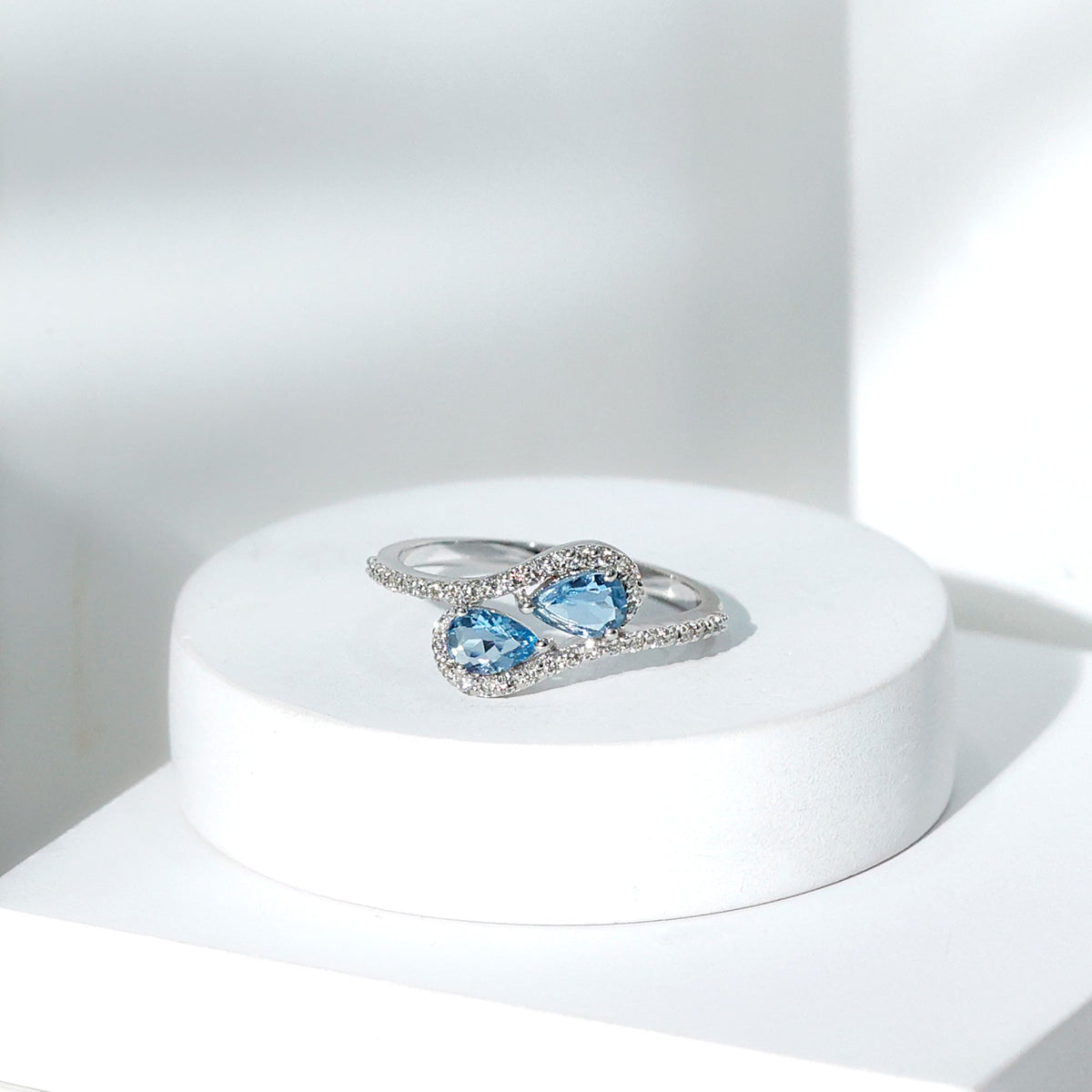 Elegant genuine aquamarine two-stone engagement ring with diamonds from Rosec Jewels, showcasing sparkling gemstones and a sleek band.