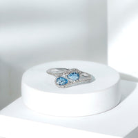 Elegant genuine aquamarine two-stone engagement ring with diamonds from Rosec Jewels, showcasing sparkling gemstones and a sleek band.