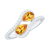 Pear-shaped citrine two-stone engagement ring with diamond accents, featuring a silver band and Rosec Jewels branding.