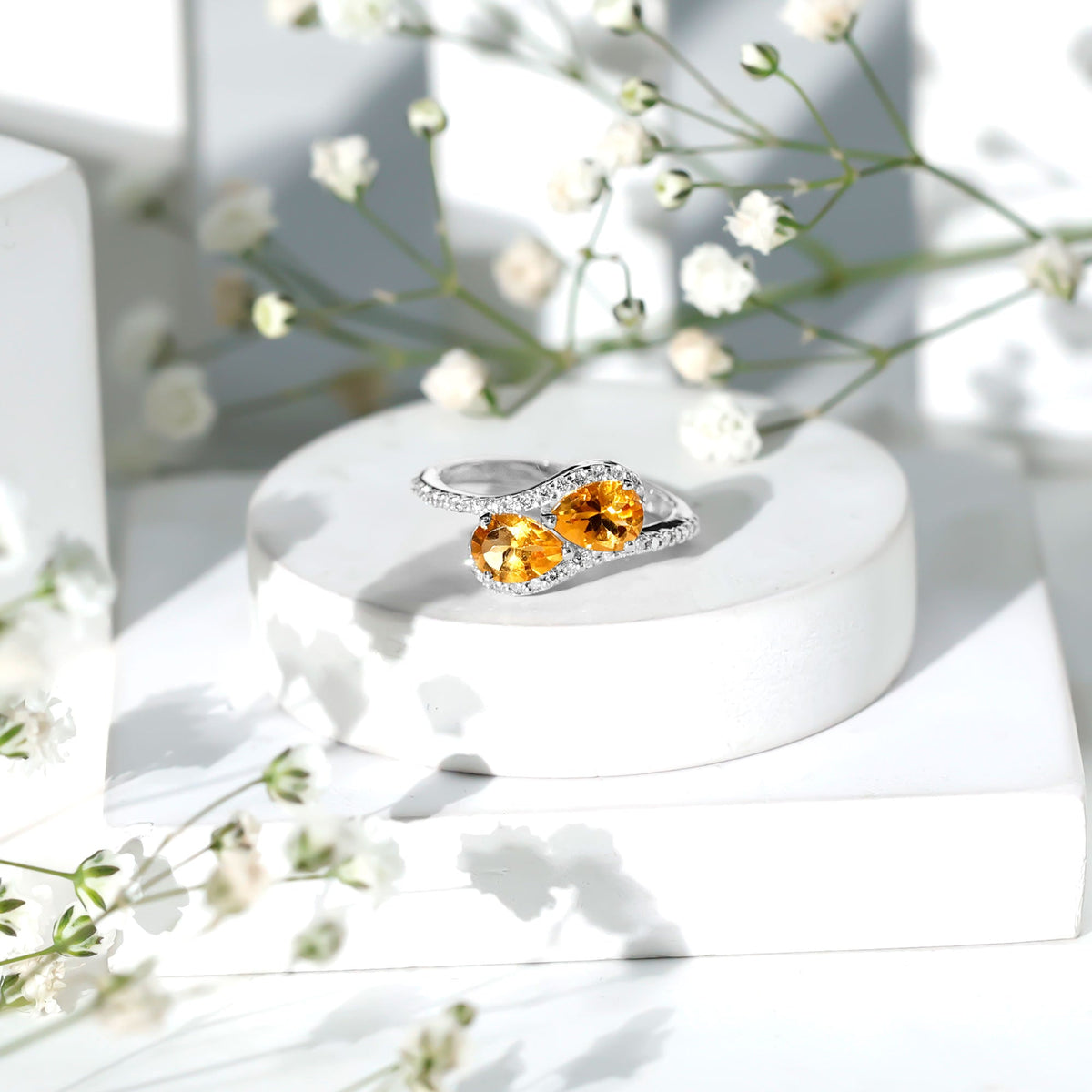 Pear-shaped citrine two-stone engagement ring with diamond accents by Rosec Jewels, featuring a gold band and elegant design.