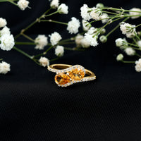 Pear-shaped citrine two-stone engagement ring with diamond accents, crafted by Rosec Jewels, showcasing the elegant jewelry design.