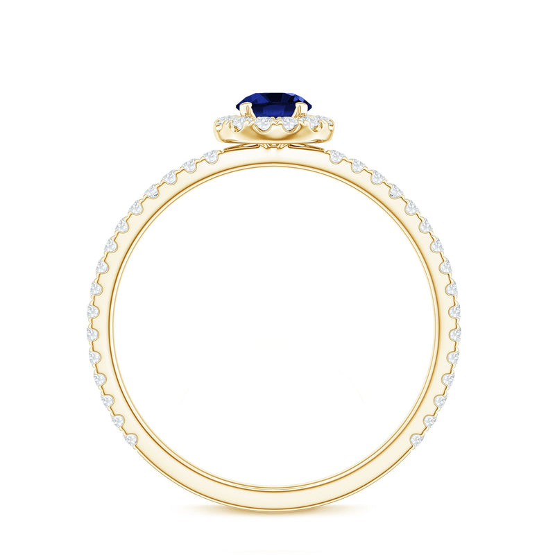Lab grown blue sapphire and diamond minimal engagement ring by Rosec Jewels, showcasing a sleek band with a central blue sapphire.