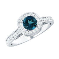 Vintage London Blue Topaz engagement ring with diamond halo, featuring intricate band details and rose gold finish.