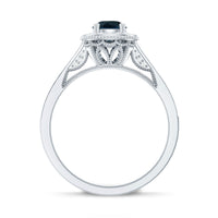 Vintage London Blue Topaz engagement ring with diamond halo from Rosec Jewels, showcasing a detailed gold band and sparkling stones.